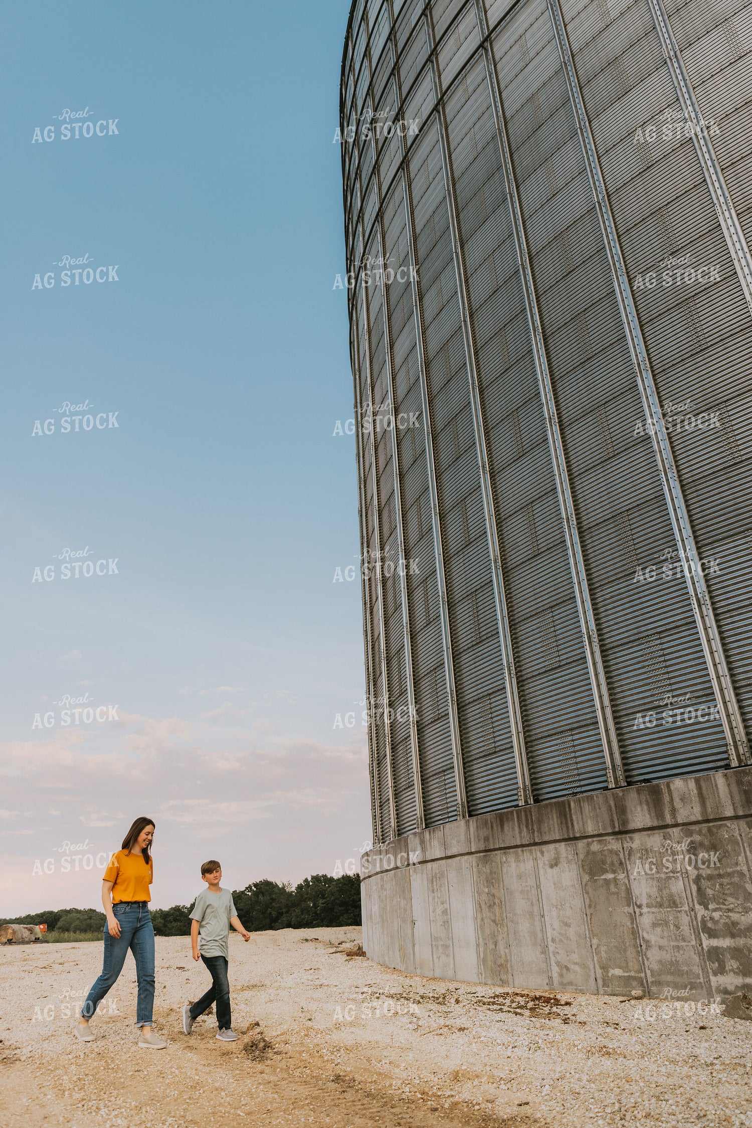 Farm Wife and Son Walk by Grain Bin 7801