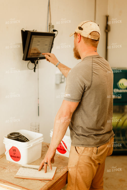 Farmer Checking Moisture of Stored Corn 9336