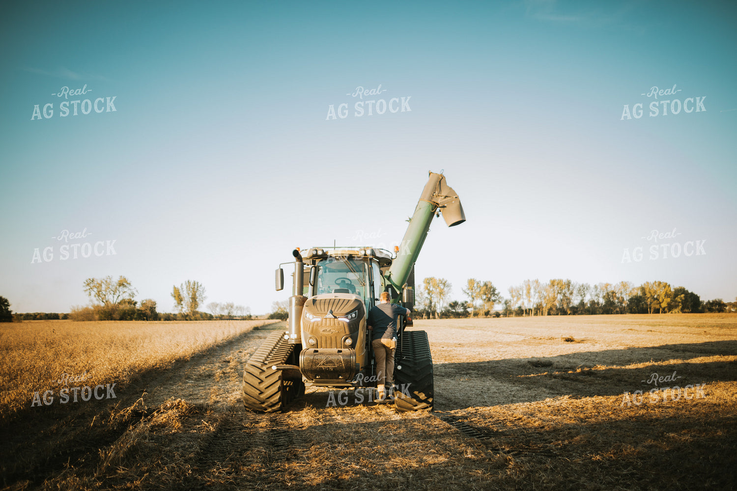 Farmer Climbing into Auger Wagon 5073