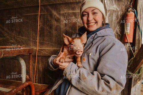 Farmer Holding Piglet 125078