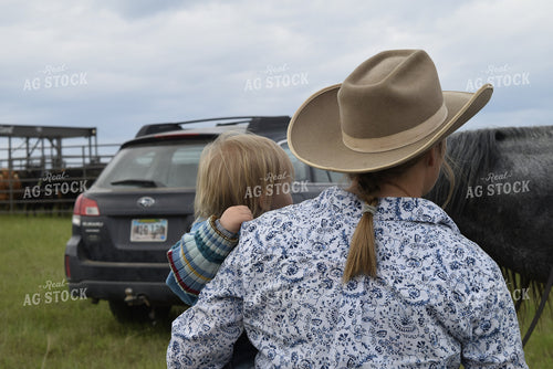 Female Rancher Holding Child 284002
