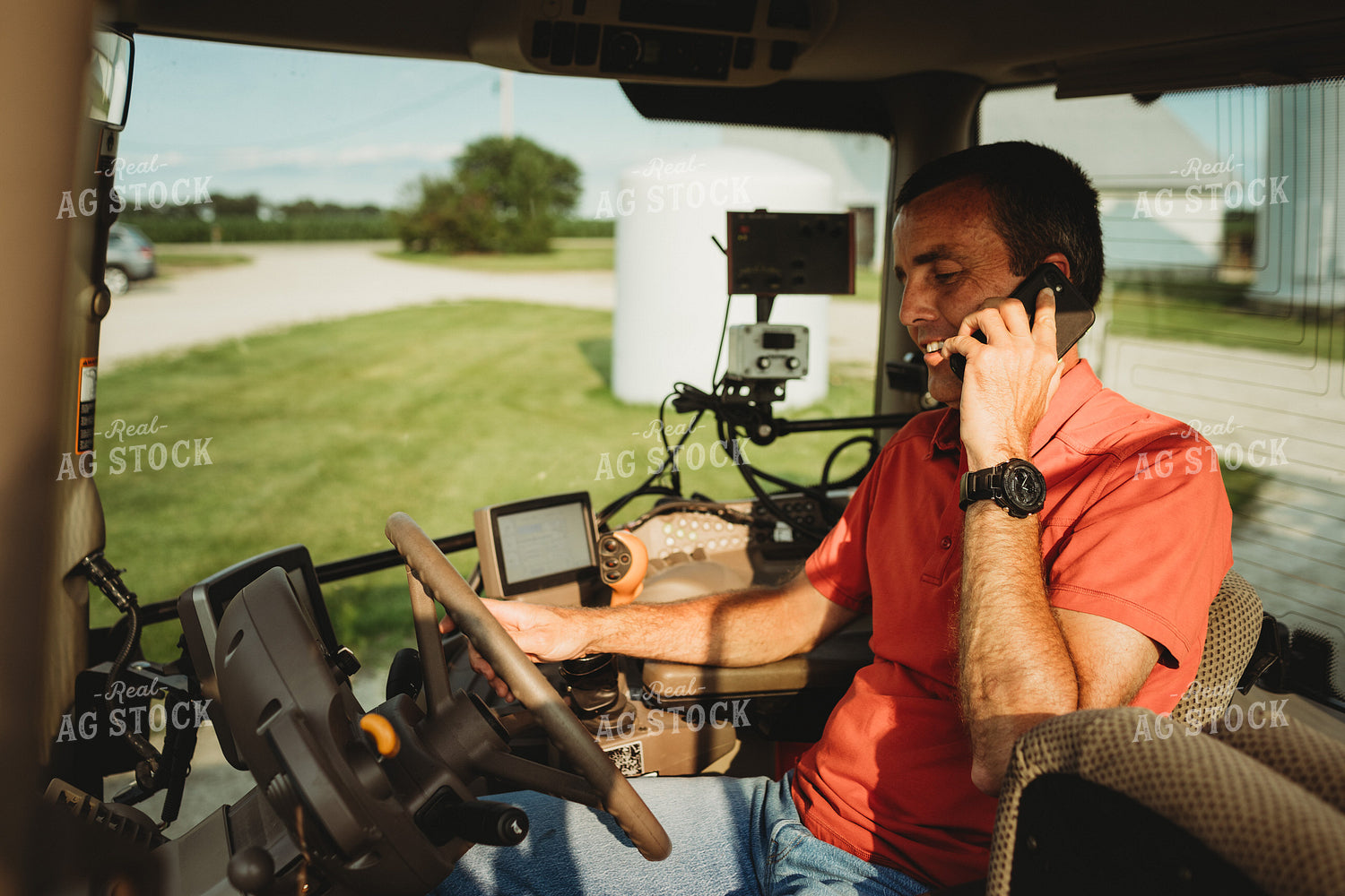 Farmer with Tractor Cab Monitors and Talking on Smart Phone 4467