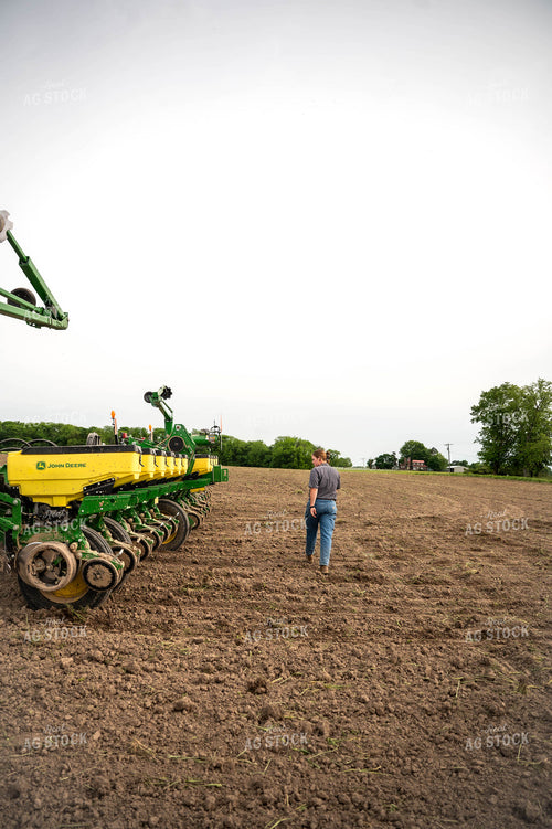 Female Farmer Walking by Planter 115654