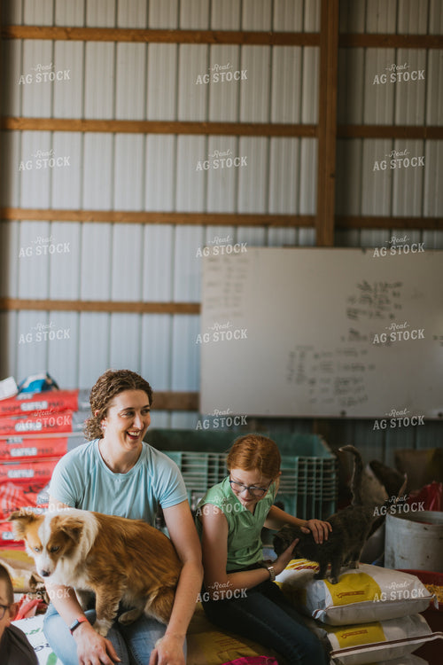 Female Farmer and Kid with Farm Dogs 7884