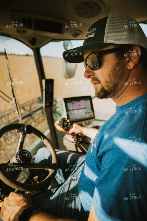 Farmer Operating Combine 7102