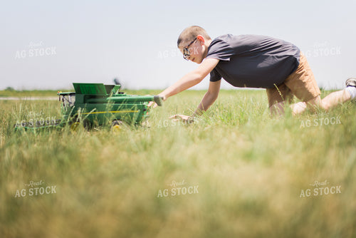 Farn Kid Plays with Toy Combine 8093