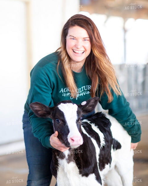 Female Farmer with Dairy Calf 55217