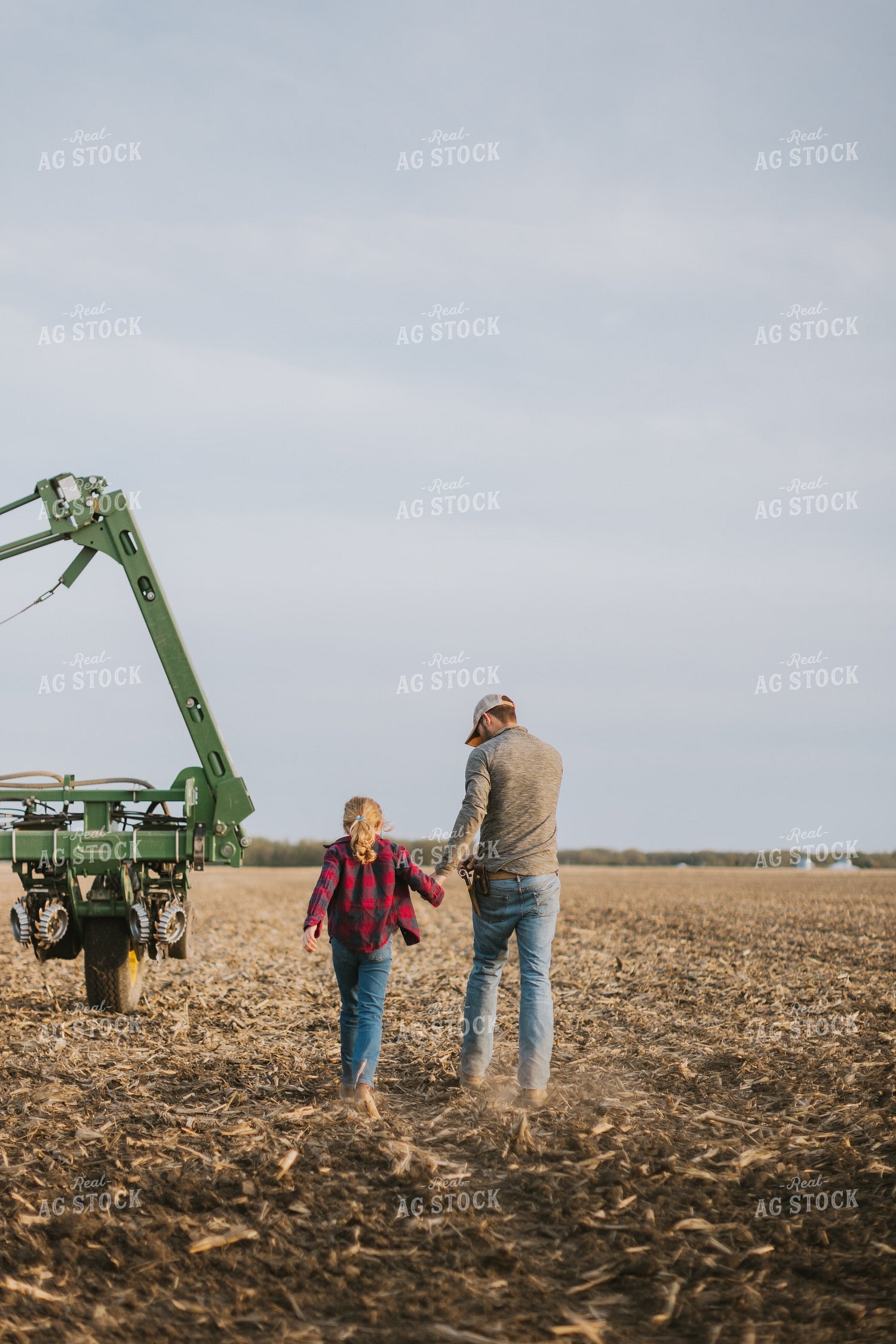 Farmer Walking in Field by Planter with Daughter 8224