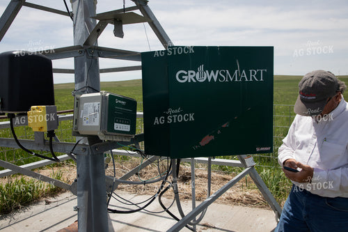 Farmer Checking Pivots 117063