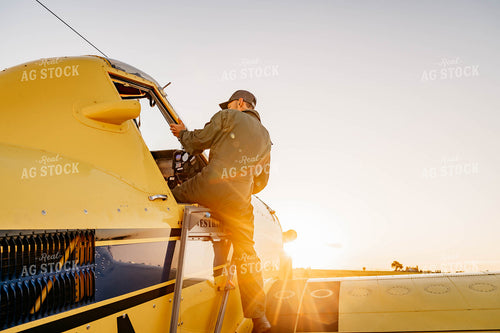 Applicator Climbing into Crop Duster 218013