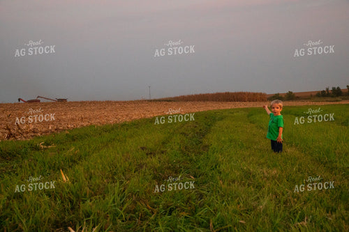 Farm Kid Waiting to Ride in the Combine 25485