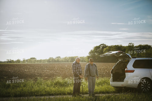 Farmer and Grandpa Standing Next to Field 4209