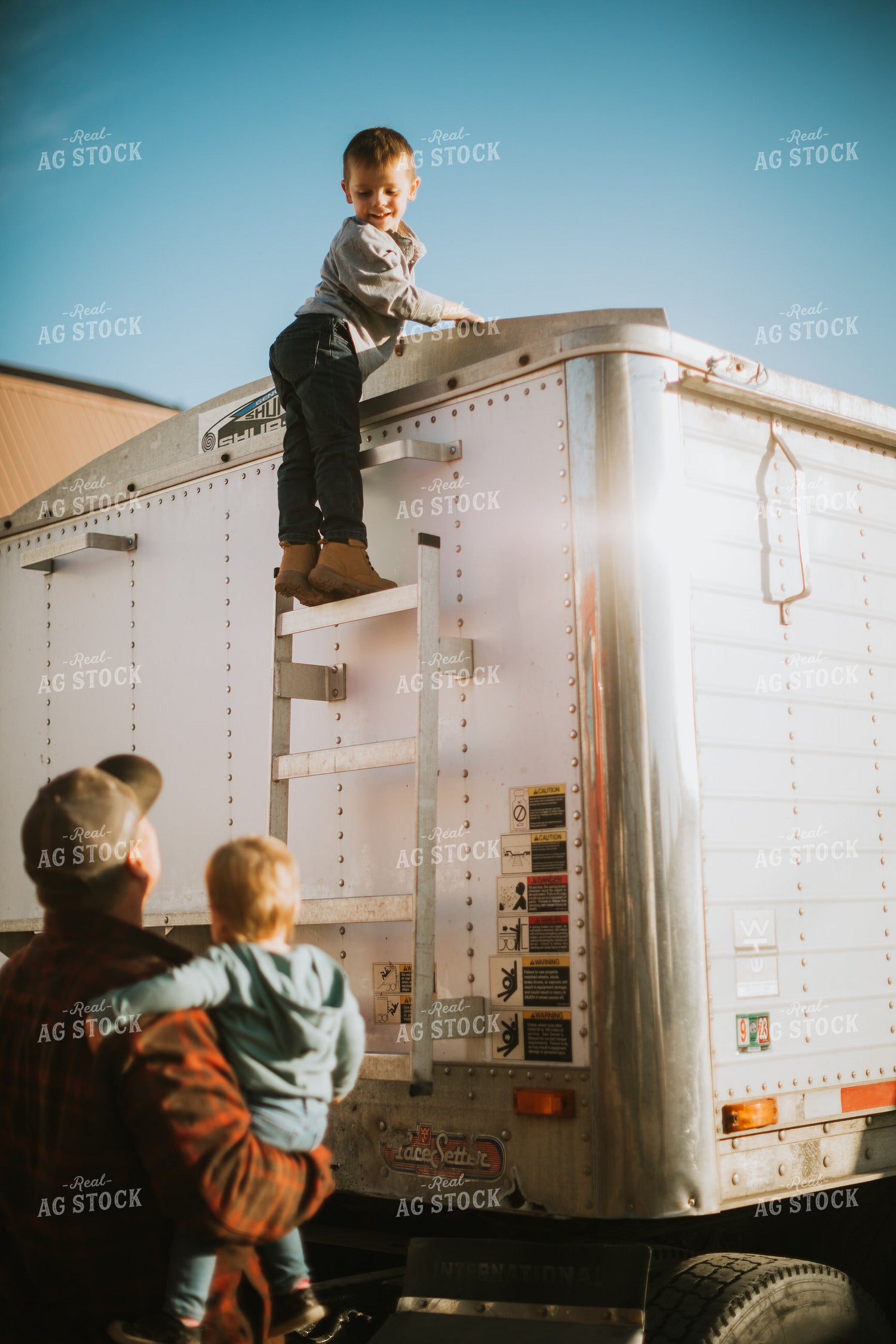 Farm Boy Climbing Up Semi Ladder 6833