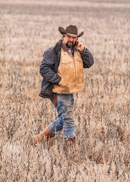 Rancher Using Phone while Walking 231058