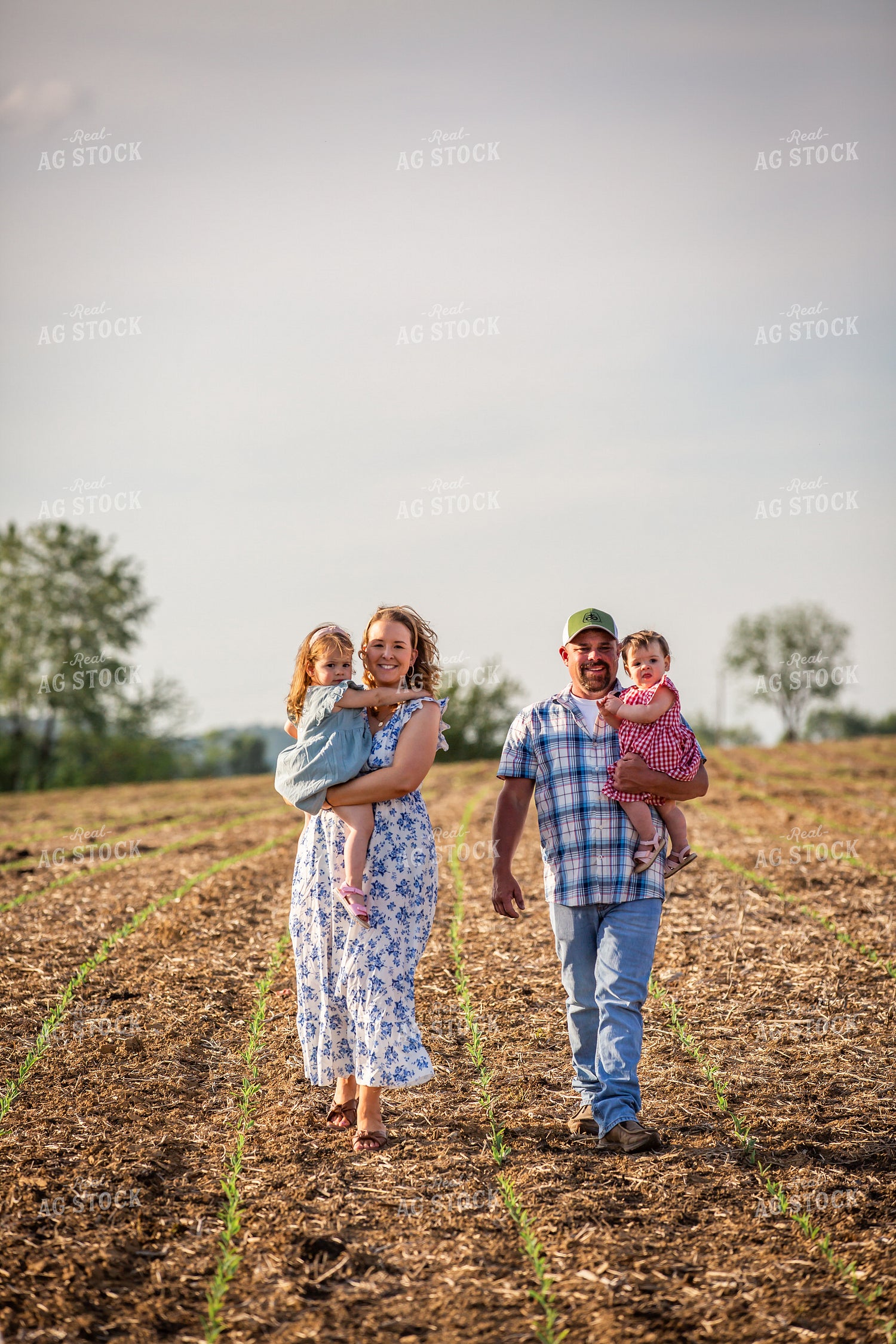 Farm Family Checking Corn 270019