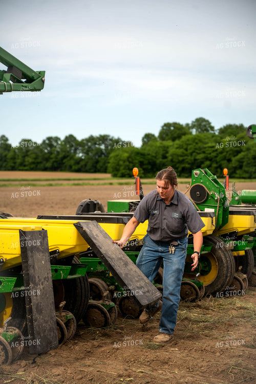 Female Farmer Filling Planter 115648