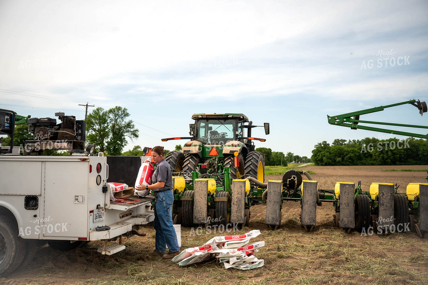 Female Farmer Filling Planter 115638