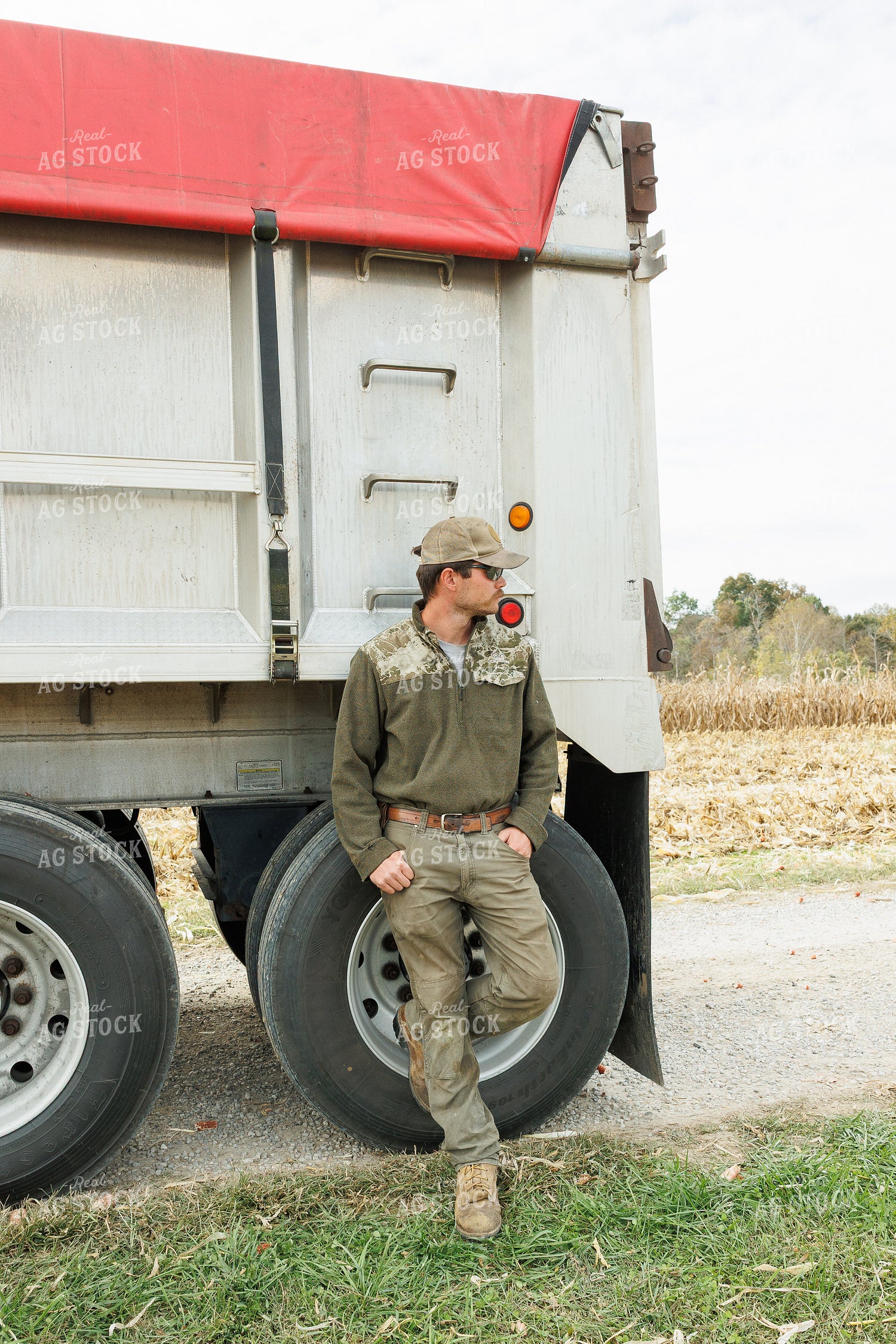 Farmer Standing by Semi Trailer 295004