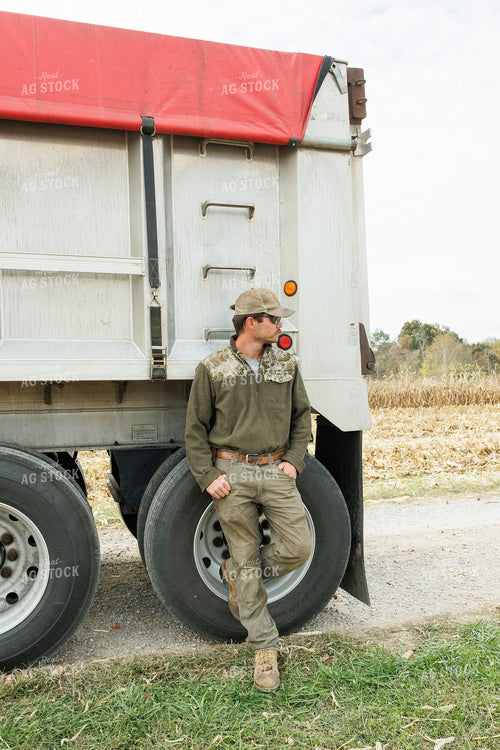 Farmer Standing by Semi Trailer 295004