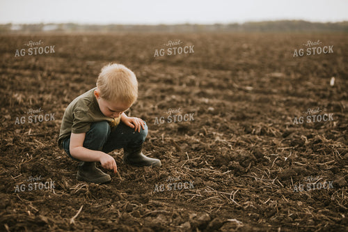 Farm Kid Checking Seed Depth 5489