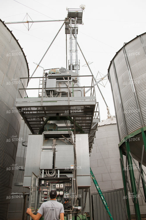 Farmer Fixing Grain Dryer 26019