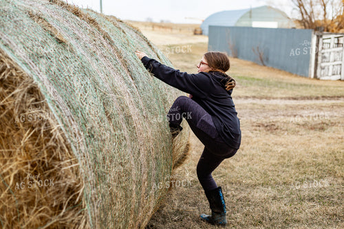 Farm Kid Climbing on Hay Bale 155574