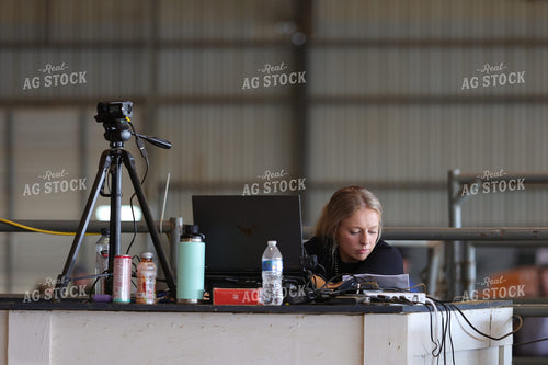 Woman Shooting Video at Stock Show 52453