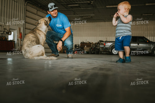 Farmer Petting Dog in Farm Shop 6201