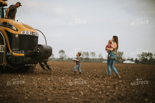 Farm Mom Taking Kids Out to Tractor During Planting 5639
