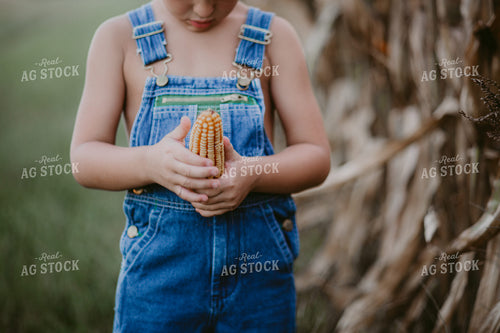 Farm Kid Holding Corn 111017