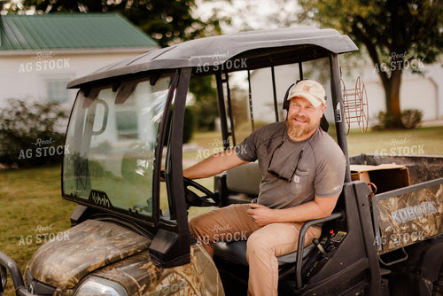 Farmer Driving Side by Side 9312