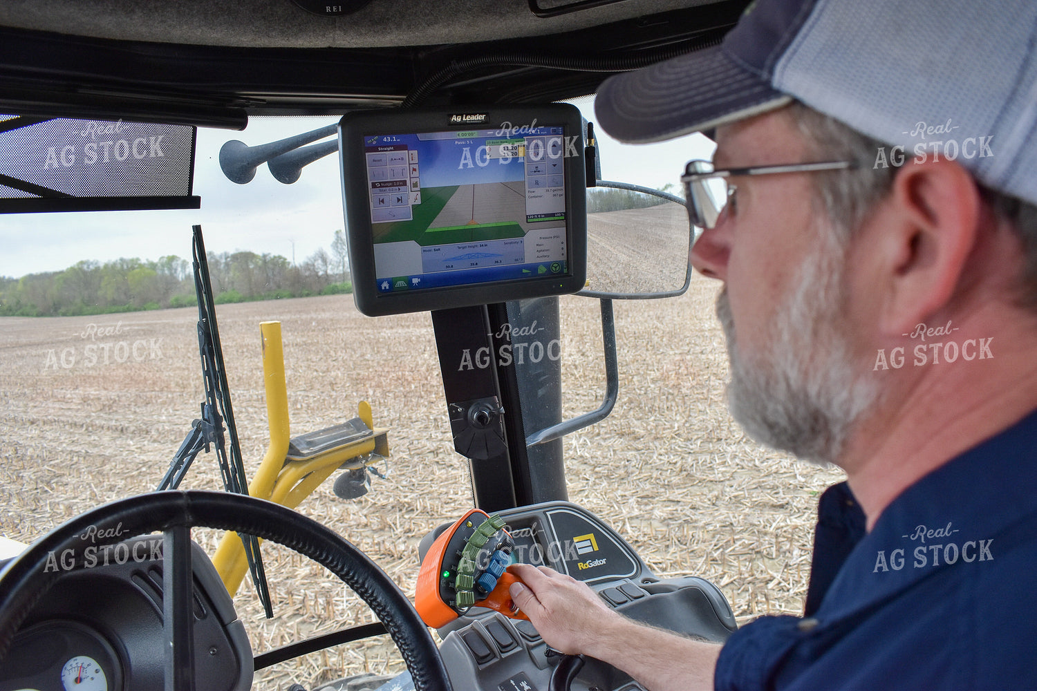 Farmer in Sprayer Cab with GPS Monitor 84019