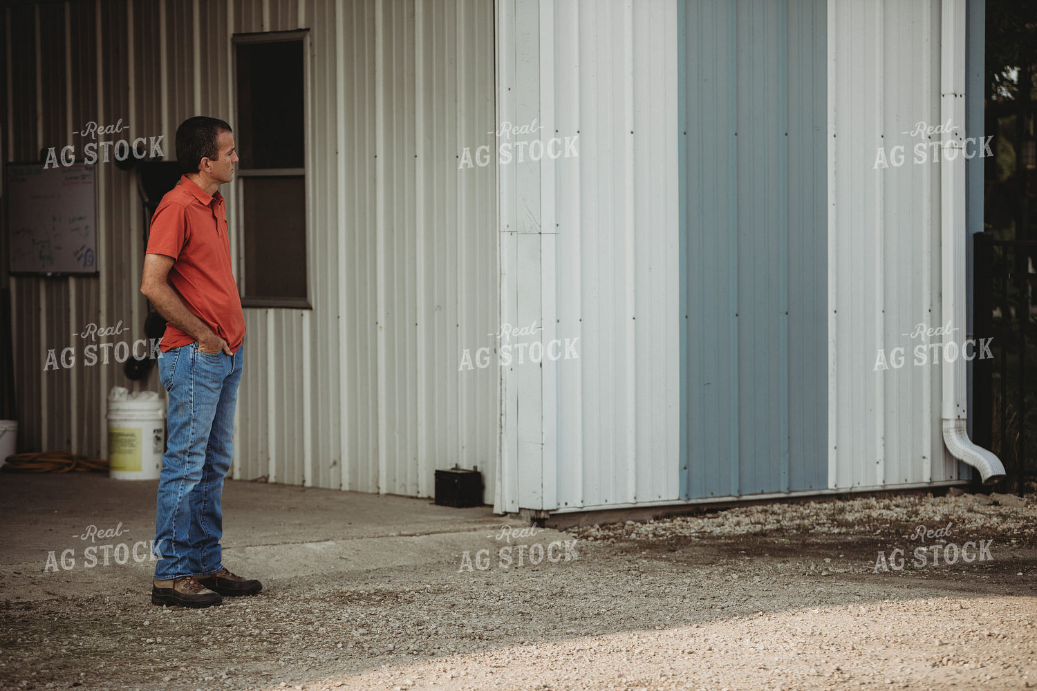 Farmer Standing Outside Shed 4479