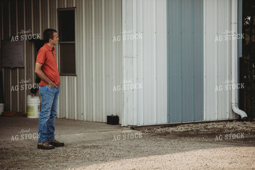 Farmer Standing Outside Shed 4479
