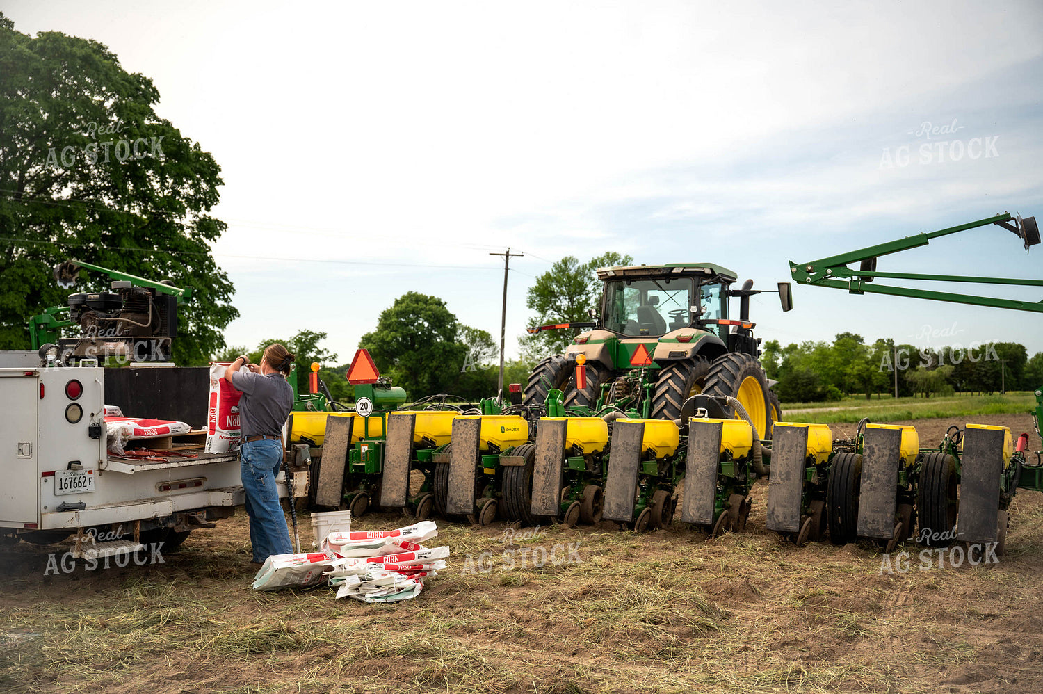 Female Farmer Filling Planter 115637