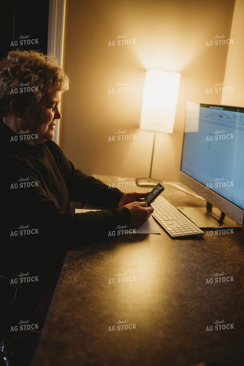 Farmer Using Smart Phone and Computer for Farm Accounting 3707