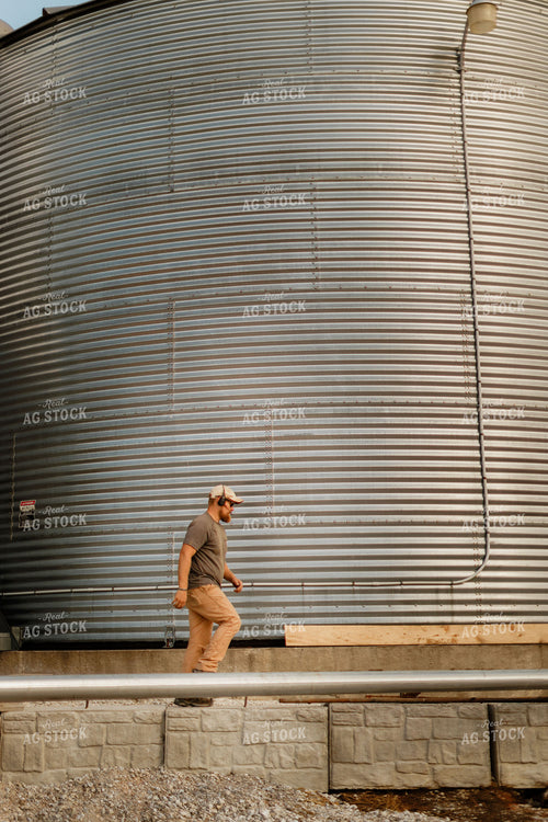 Farmer Climbing Down Grain Bin 9345