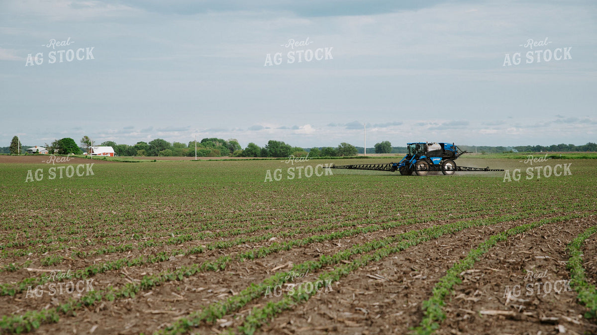 Self-Propelled Sprayer Applying Crop Protection on Early-Season Field 401000
