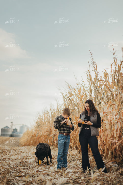 Farm Wife and Kid Checking Corn 9467