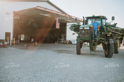 Farmer Climbing Out of Sprayer 6219