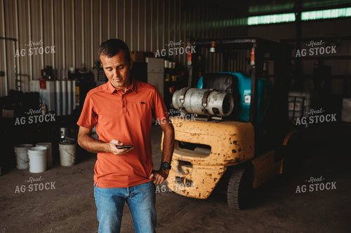Farmer on Phone in Shop 4525