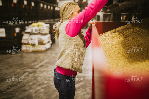 Forklift Operator Emptying Bulk Bin in Seed Warehouse 5351