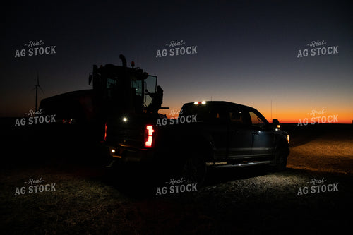 Farmer Climbing into Tractor at Sunrise 25854