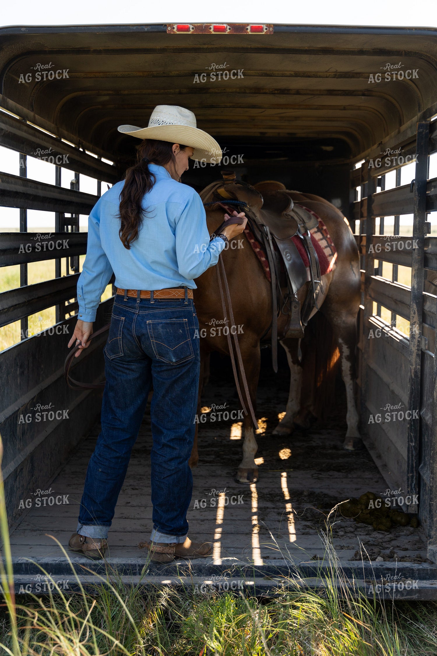 Female Rancher and Horse on Trailer 71034