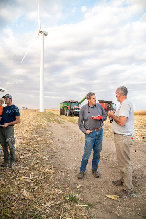 Family Enjoying Harvest Meal in the Field 25821