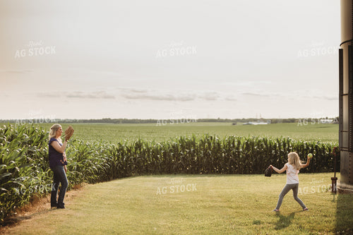Farm Family Playing Catch Alongside Corn Field 4486