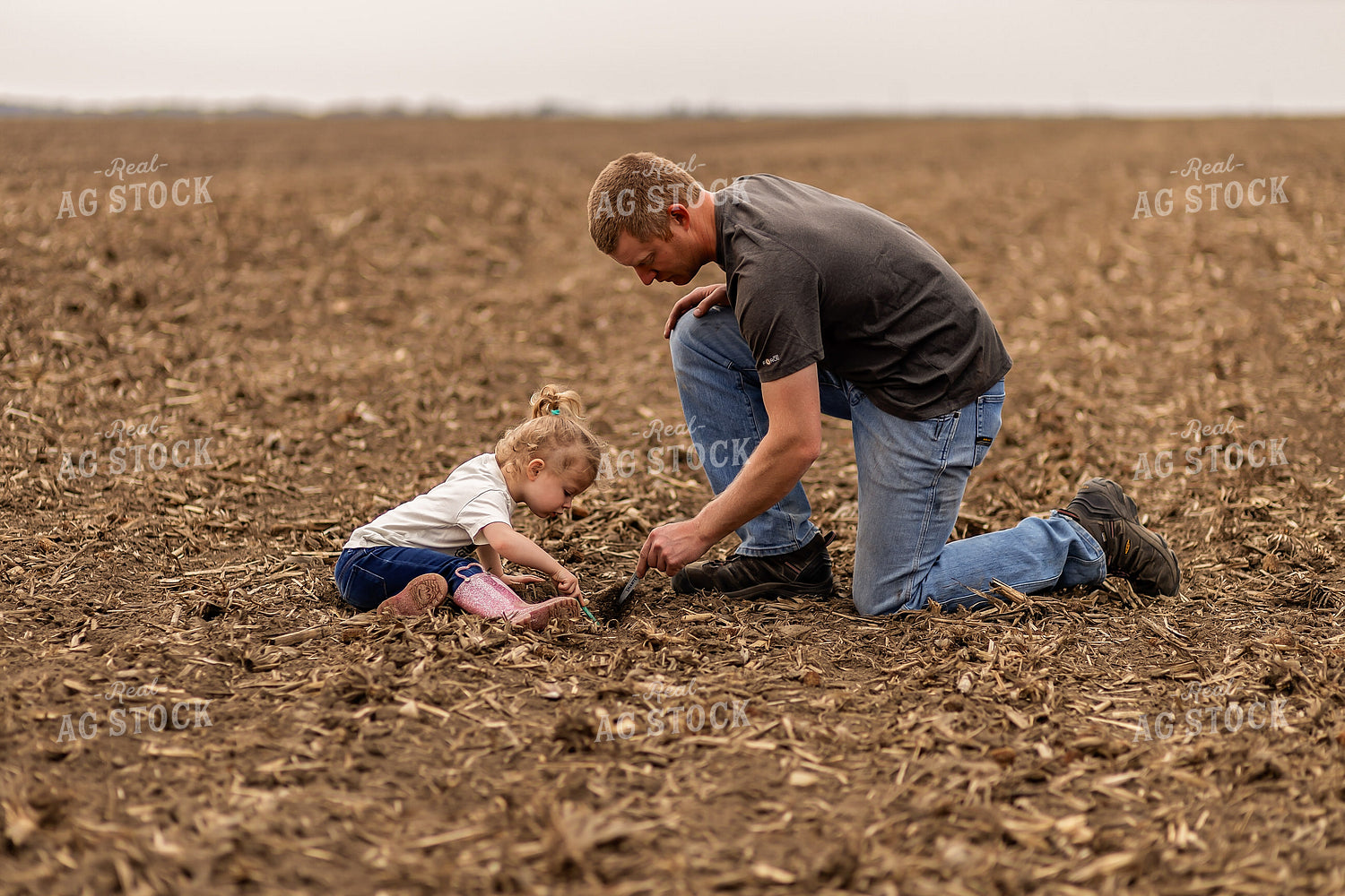 Farmer and Daughter Checking Soybeans 93292