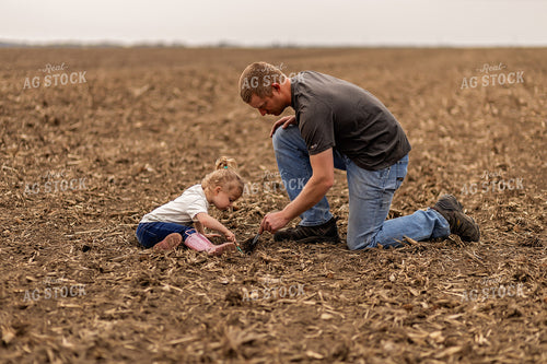 Farmer and Daughter Checking Soybeans 93292