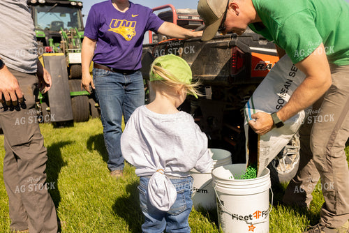 Farm Kid Helping Plant a Seed Plot 161169