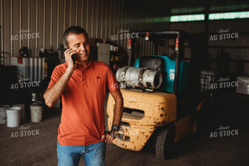 Farmer on Phone in Shop 4523
